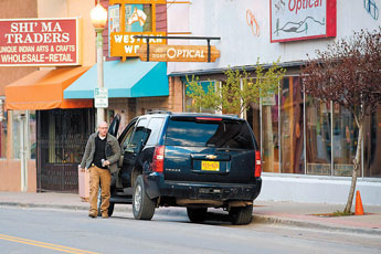 An agent parks in front of Jet-Site Optical in downtown Gallup.  © 2011 Gallup Independent / Brian Leddy